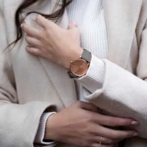 Monroe Maestro rose gold watch with grey leather strap.